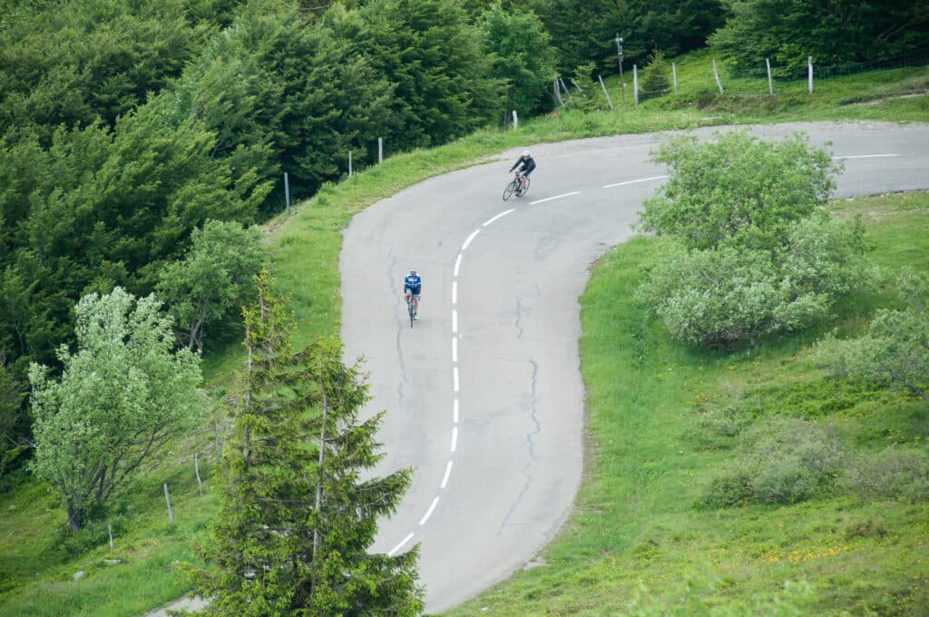 two cyclists in beautiful mountain laces road in top vieuw in grand ballon in Alsace